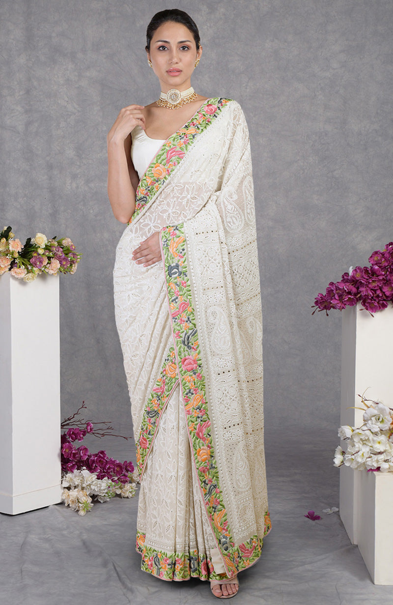 Ivory Georgette saree with hand-embroidered Chikankari and Parsi Gara floral and bird motifs.