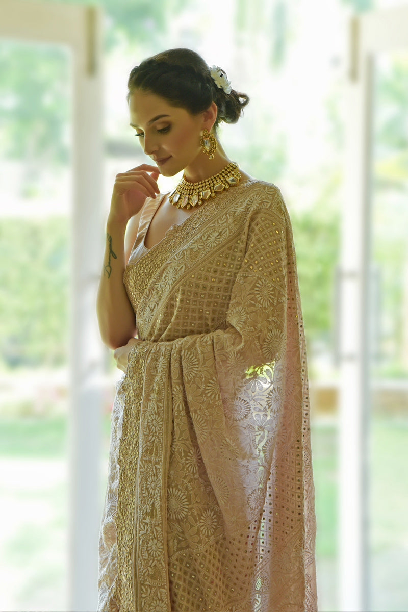 Oyster pink georgette saree with intricate hand-embroidered Chikankari and rose gold gota patti borders