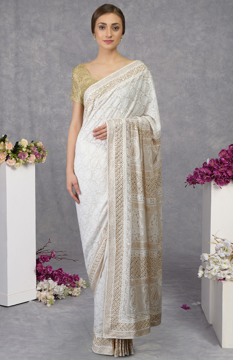 Ivory georgette saree with intricate floral Chikankari and gold cut dana embroidery on borders.