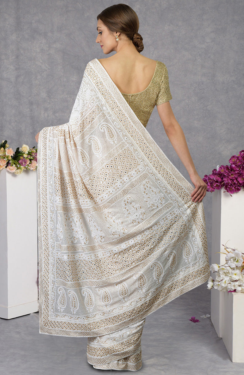Ivory georgette saree with intricate floral Chikankari and gold cut dana embroidery on borders.