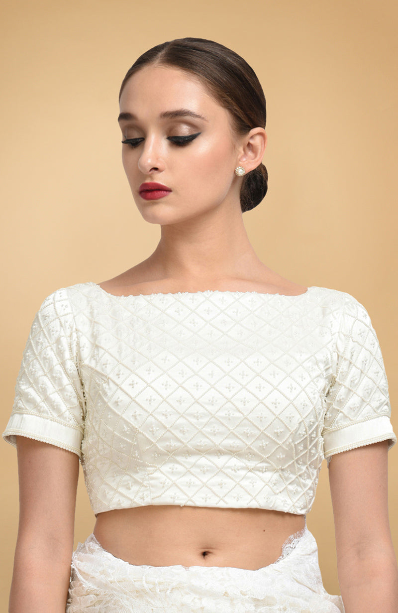 Ivory French Chantilly lace saree with pearl-beaded hand-embroidered satin silk blouse