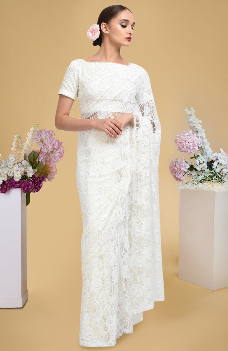 Ivory French Chantilly lace saree with pearl-beaded hand-embroidered satin silk blouse.