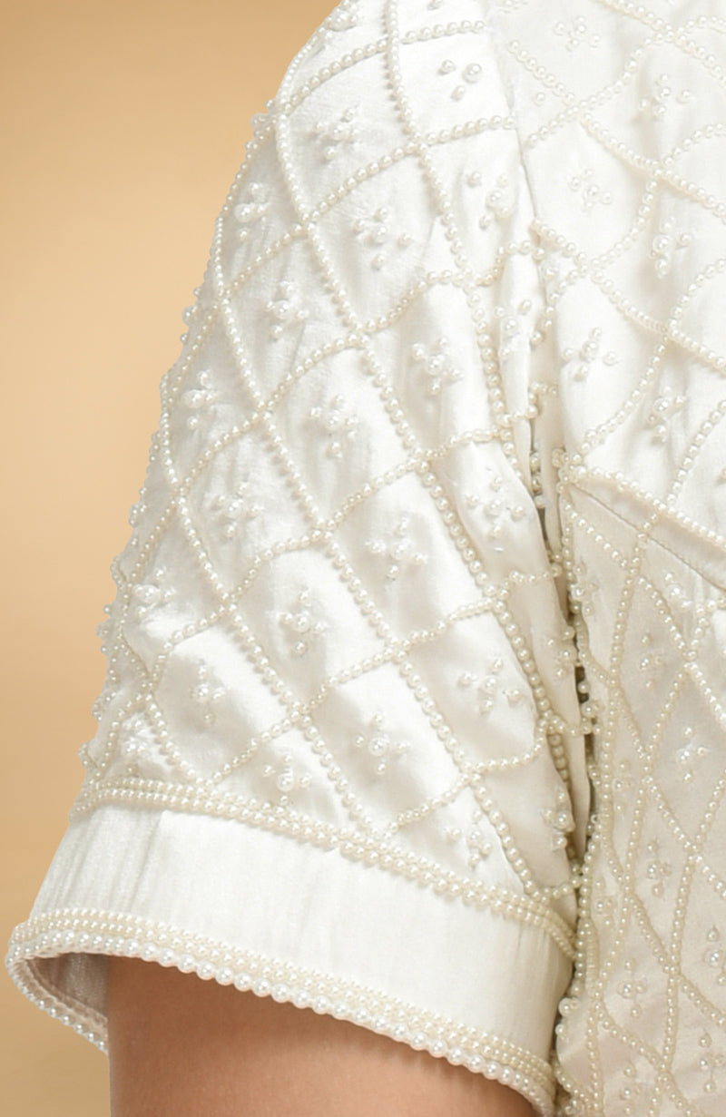 Ivory French Chantilly lace saree with pearl-beaded hand-embroidered satin silk blouse