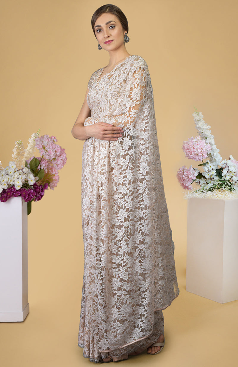 Nude peach saree with French Chantilly lace and hand embroidered satin silk blouse fabric.