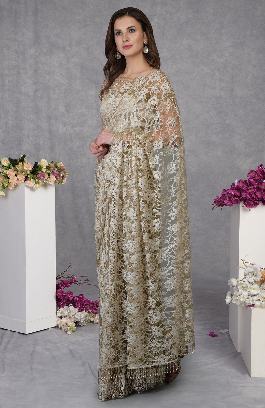 Beige French Chantilly lace saree with embroidered pearl bead floral blouse and satin fabric.