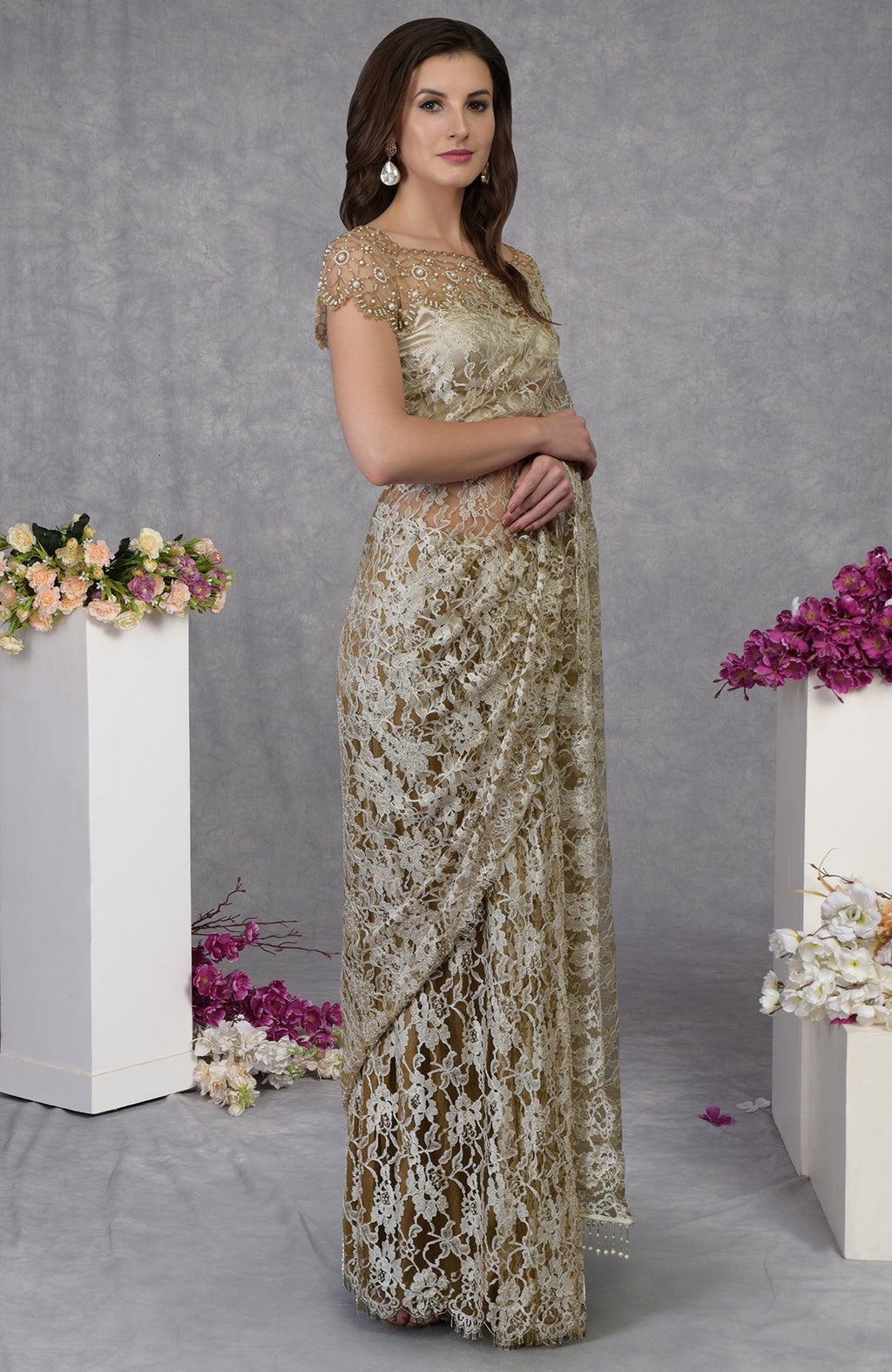 Beige French Chantilly lace saree with embroidered pearl bead floral blouse and satin fabric.