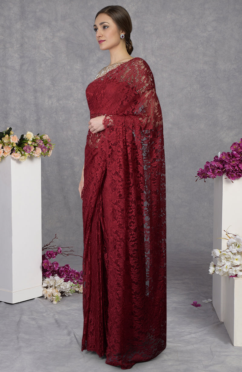 Maroon French Chantilly lace saree with hand embroidered pearl bead blouse and floral motifs