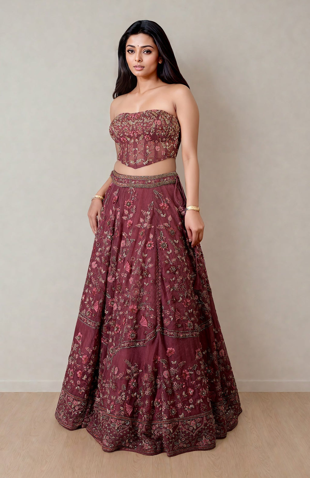 Burgundy wine lehenga with floral embroidery and fitted corset featuring crystal embellishments