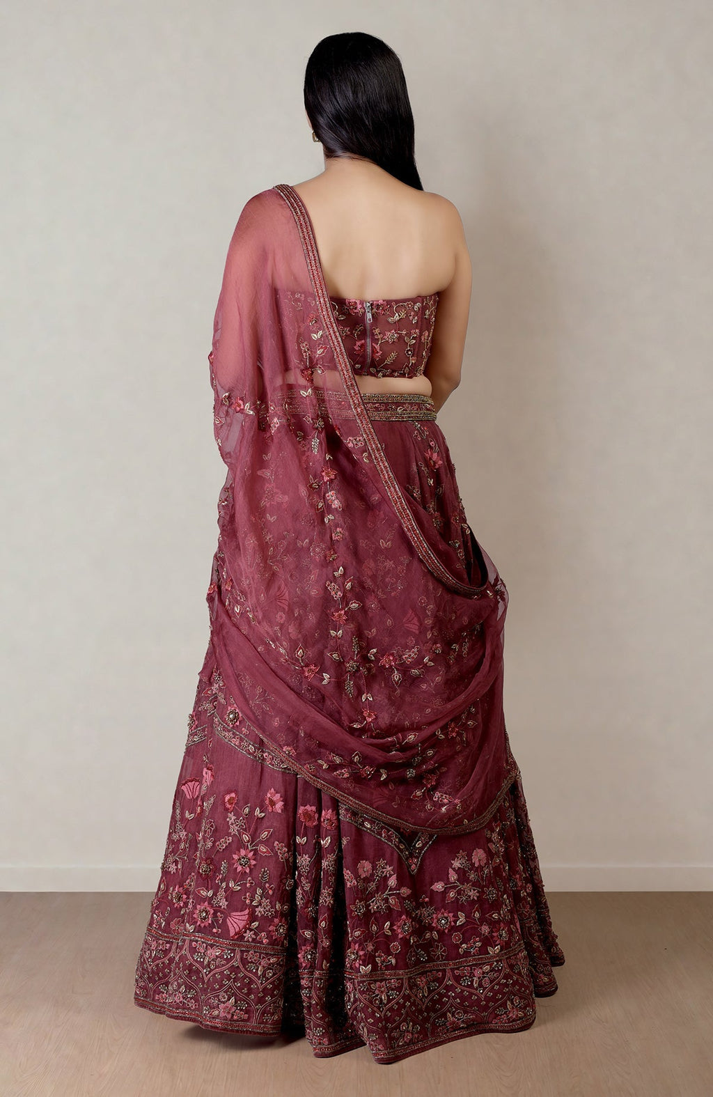 Burgundy wine lehenga with fitted corset, floral embroidery, crystal and bead embellishments.