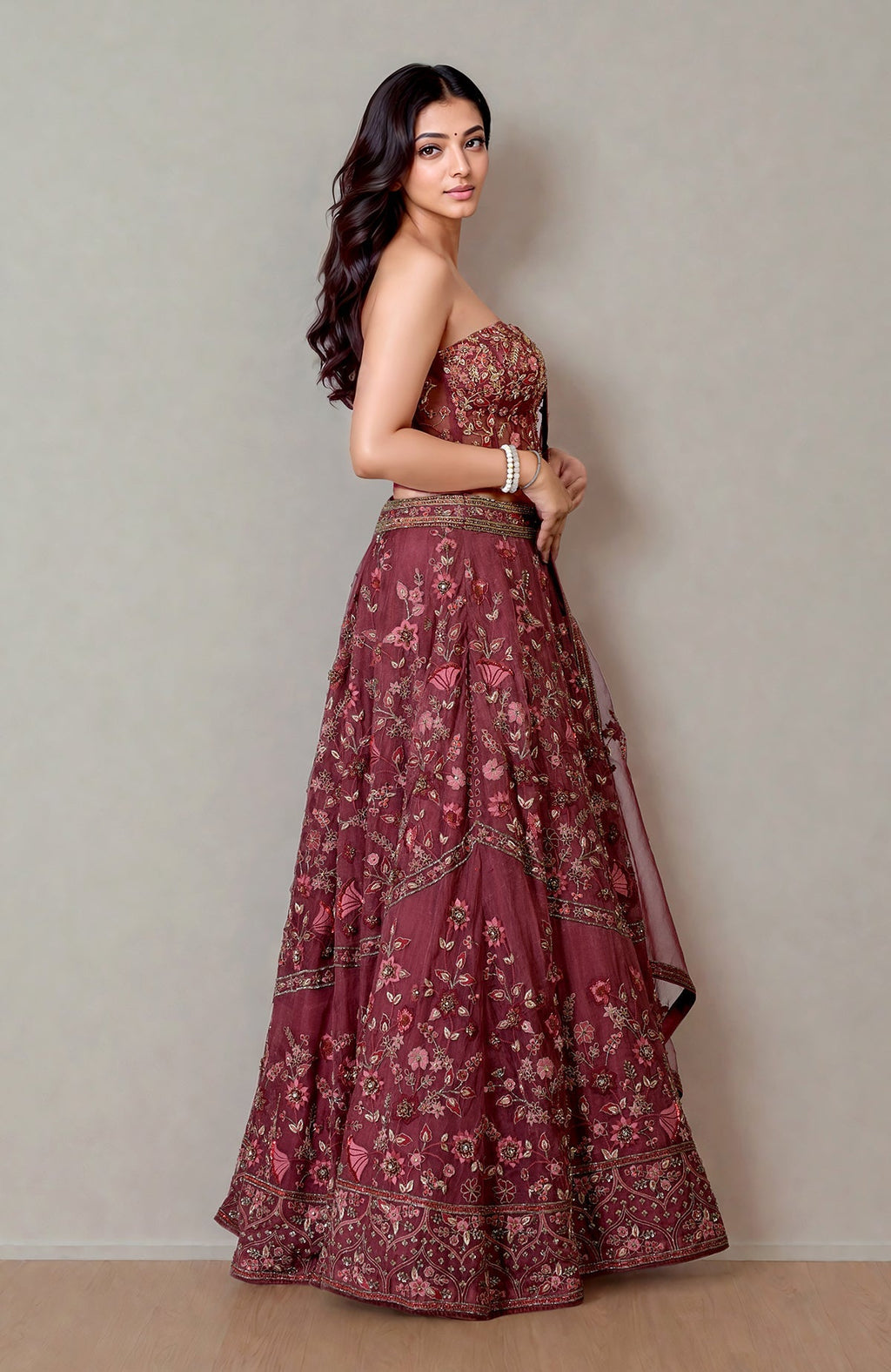 Burgundy wine lehenga with floral embroidery and fitted corset embellished with crystals and beads