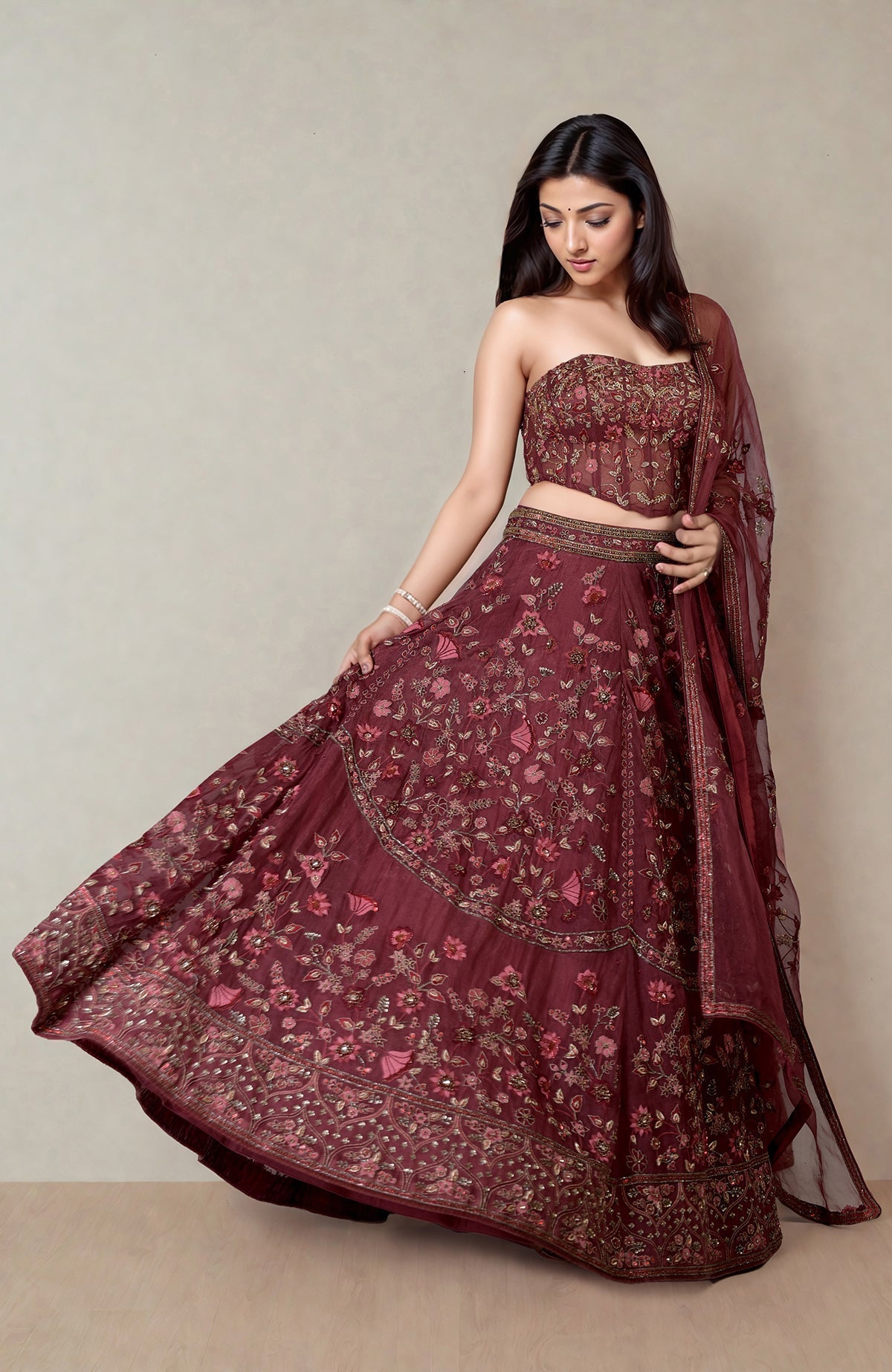 Burgundy wine lehenga with floral embroidery and a fitted corset with crystal embellishments