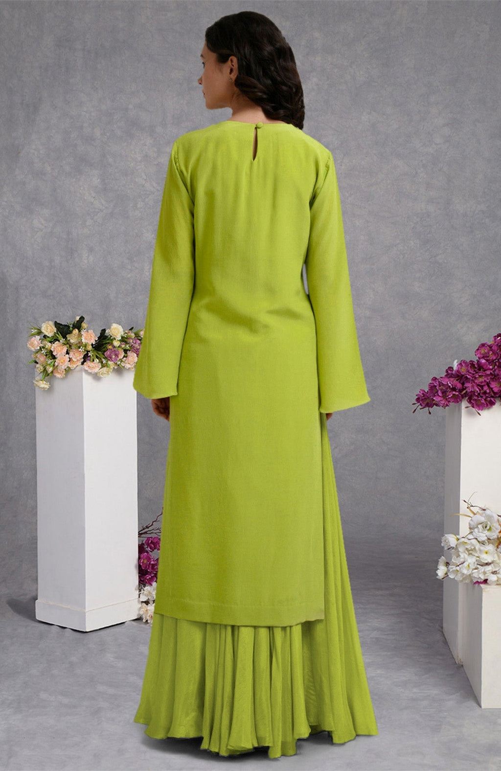 Lime punch skirt set with hand-embroidered gold and silver sequins on crepe fabric.