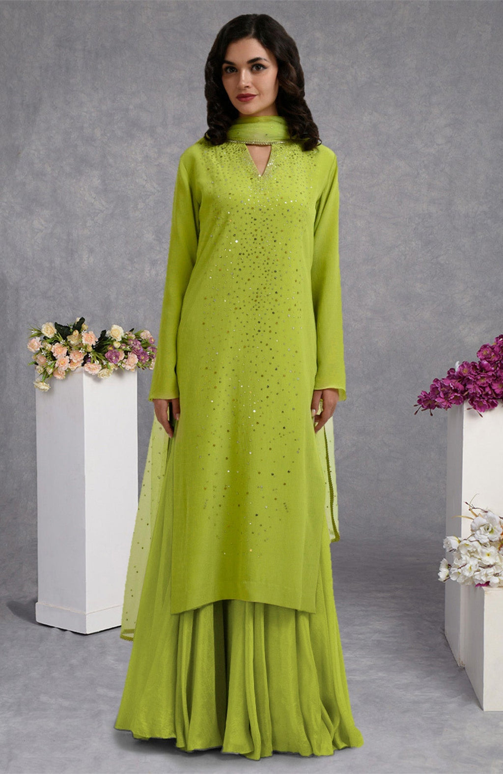 Lime punch skirt set with hand-embroidered gold and silver sequins and sheer bell sleeves.
