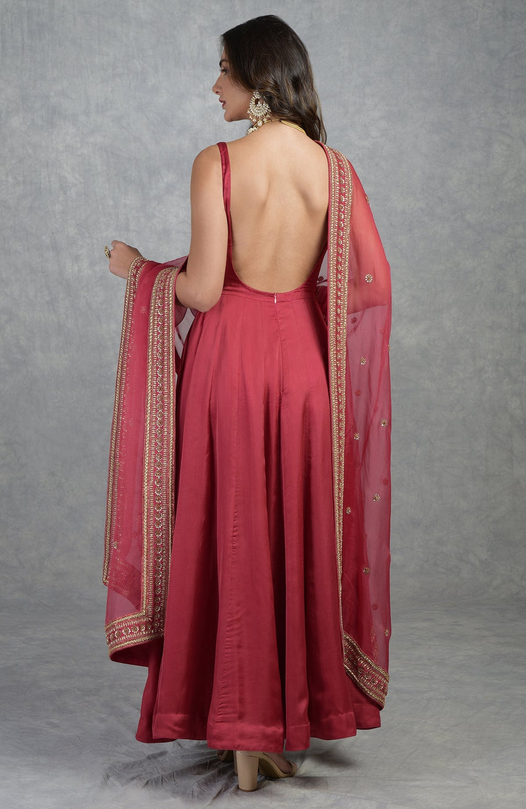 Garnet red Anarkali set with hand-embroidered zardozi floral motifs and organza dupatta.