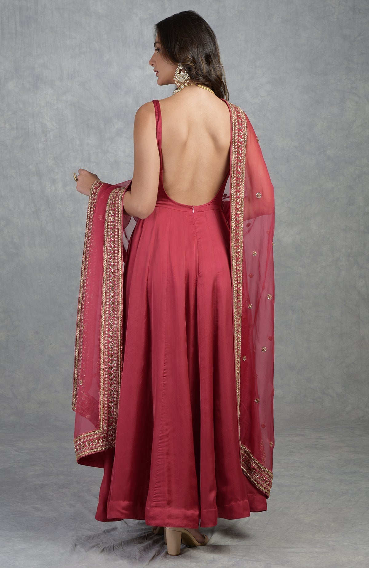 Garnet red Anarkali set with hand-embroidered zardozi floral motifs and organza dupatta.