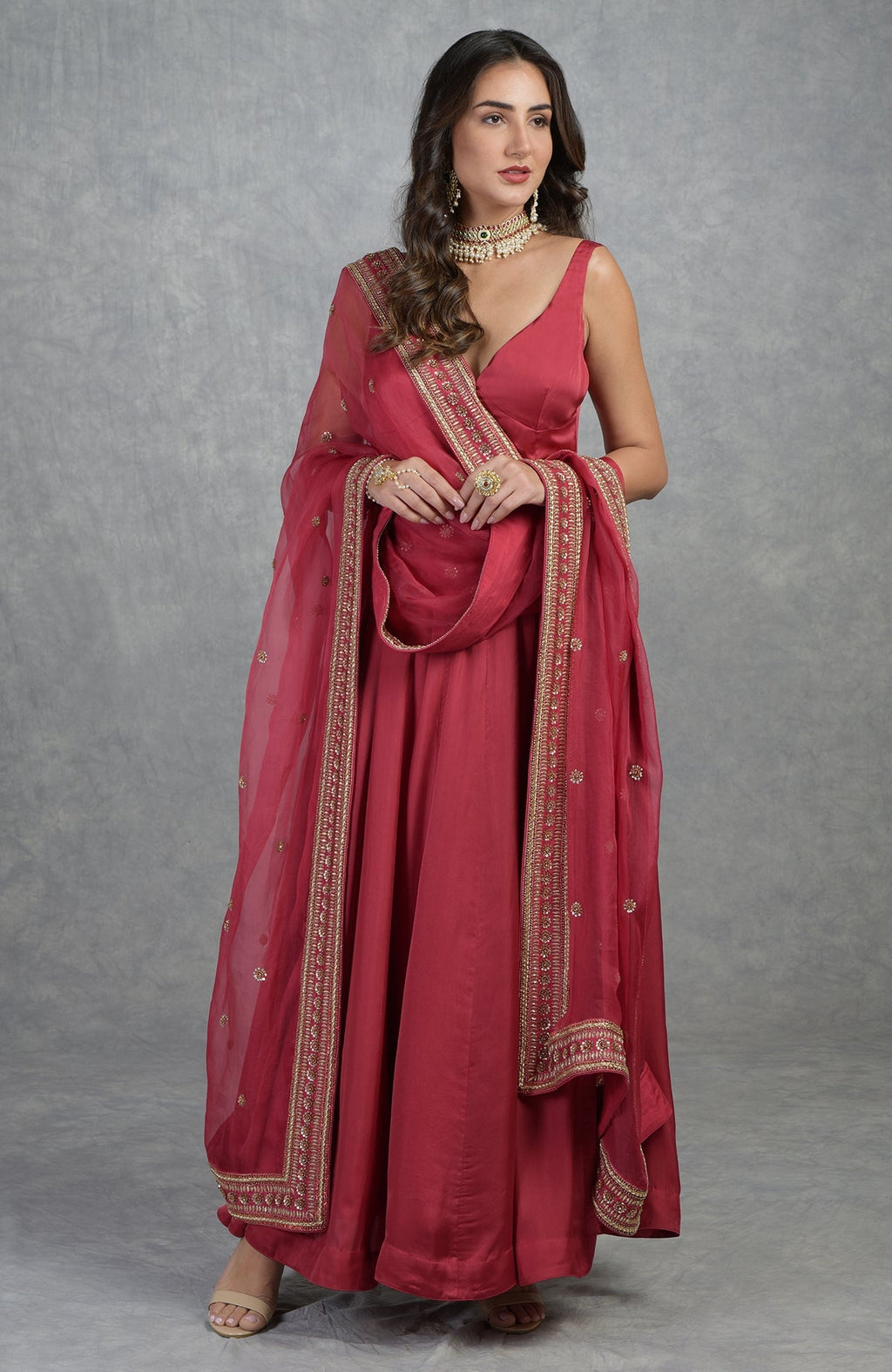 Garnet red Anarkali set with hand-embroidered zardozi floral motifs and flared organza silhouette