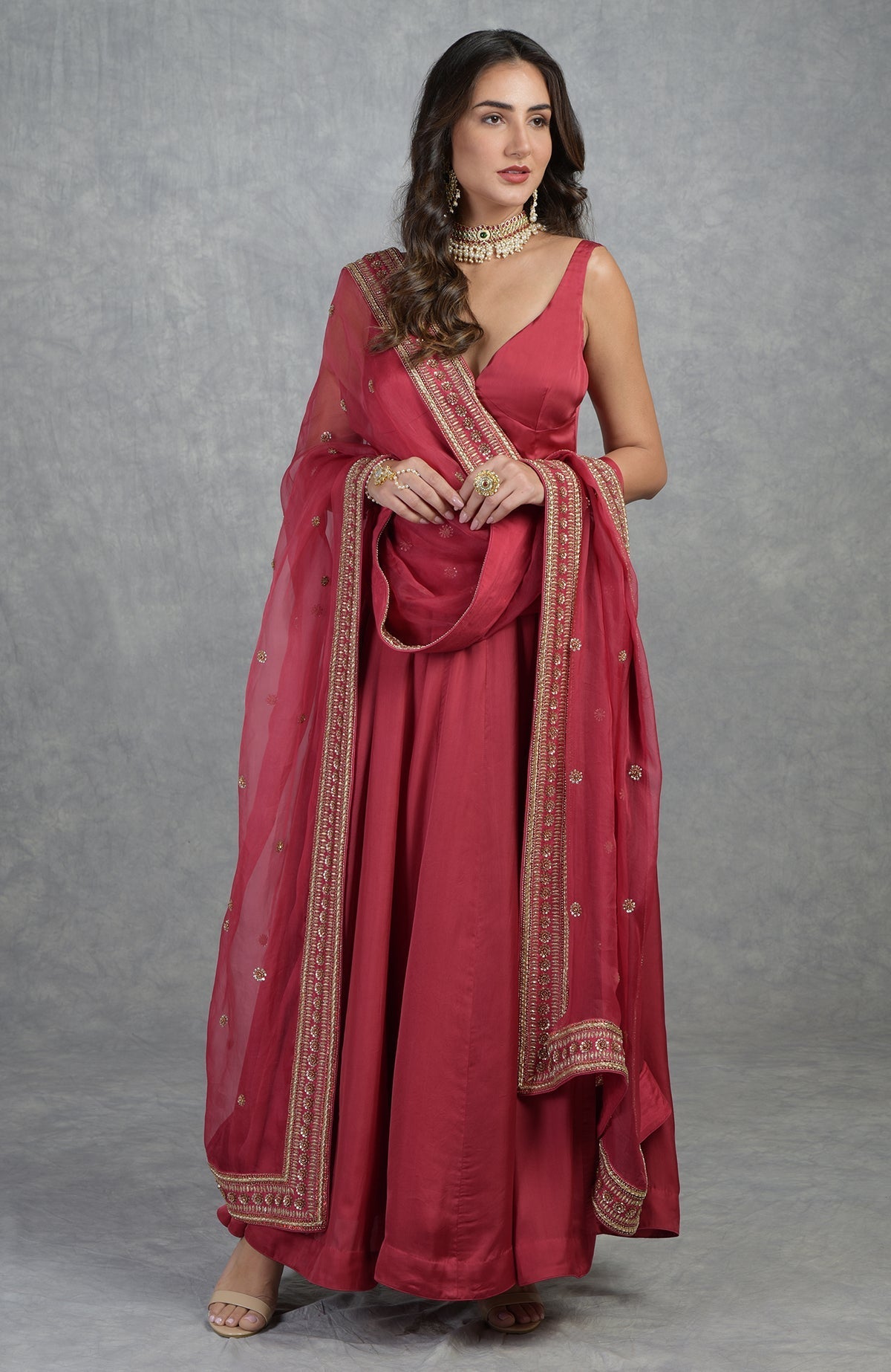 Garnet red Anarkali set with hand-embroidered zardozi floral motifs and flared organza silhouette