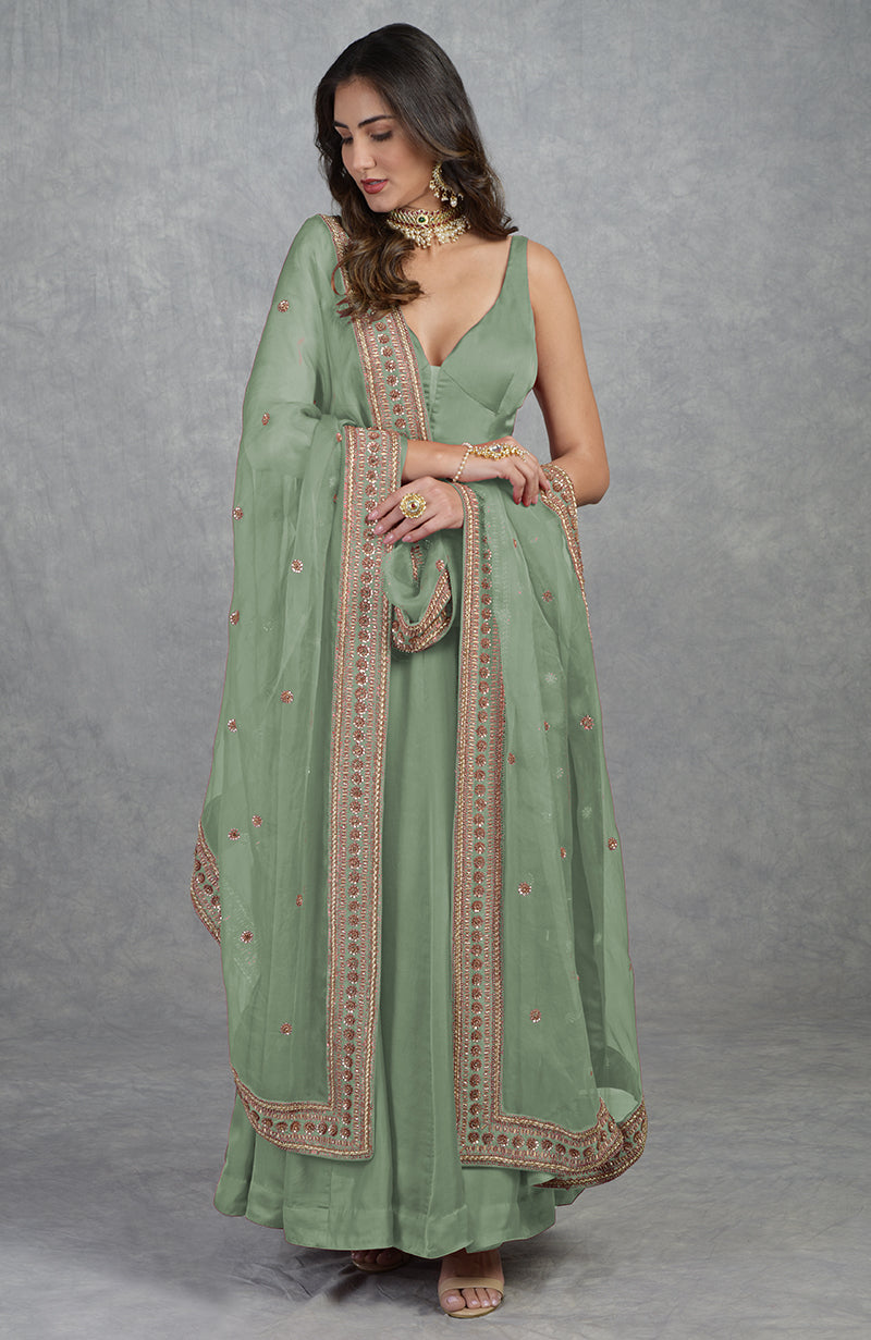 Garnet red Anarkali set with hand-embroidered zardozi floral motifs and matching churidaar.