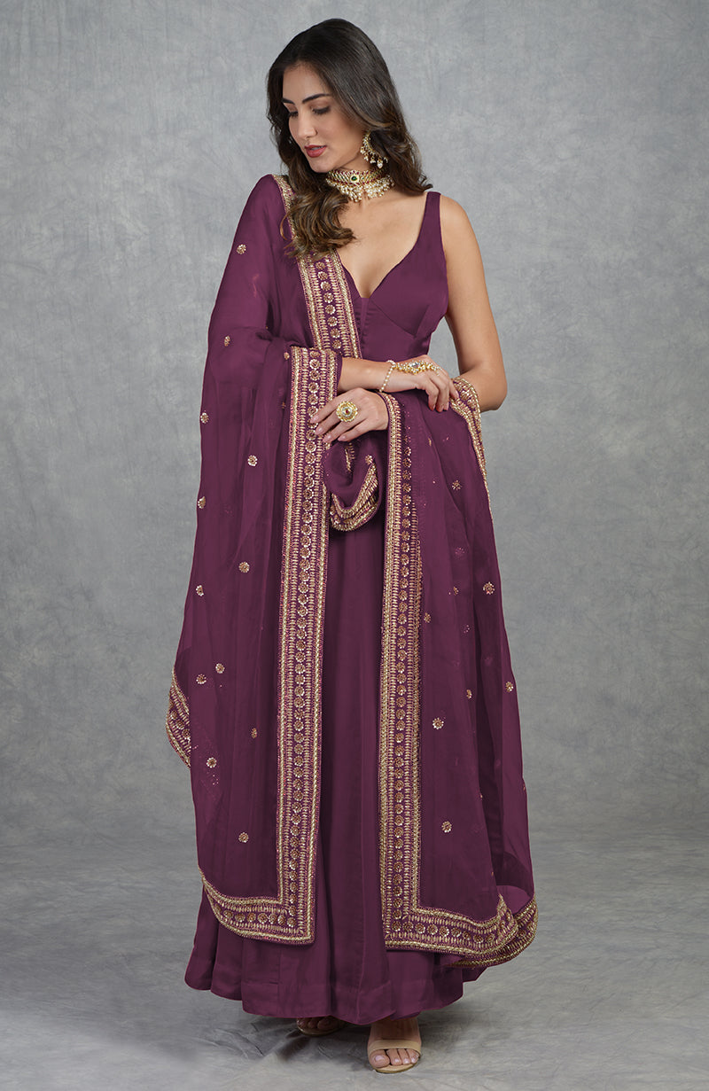 Garnet red Anarkali set with hand-embroidered zardozi and floral motifs on organza fabric.