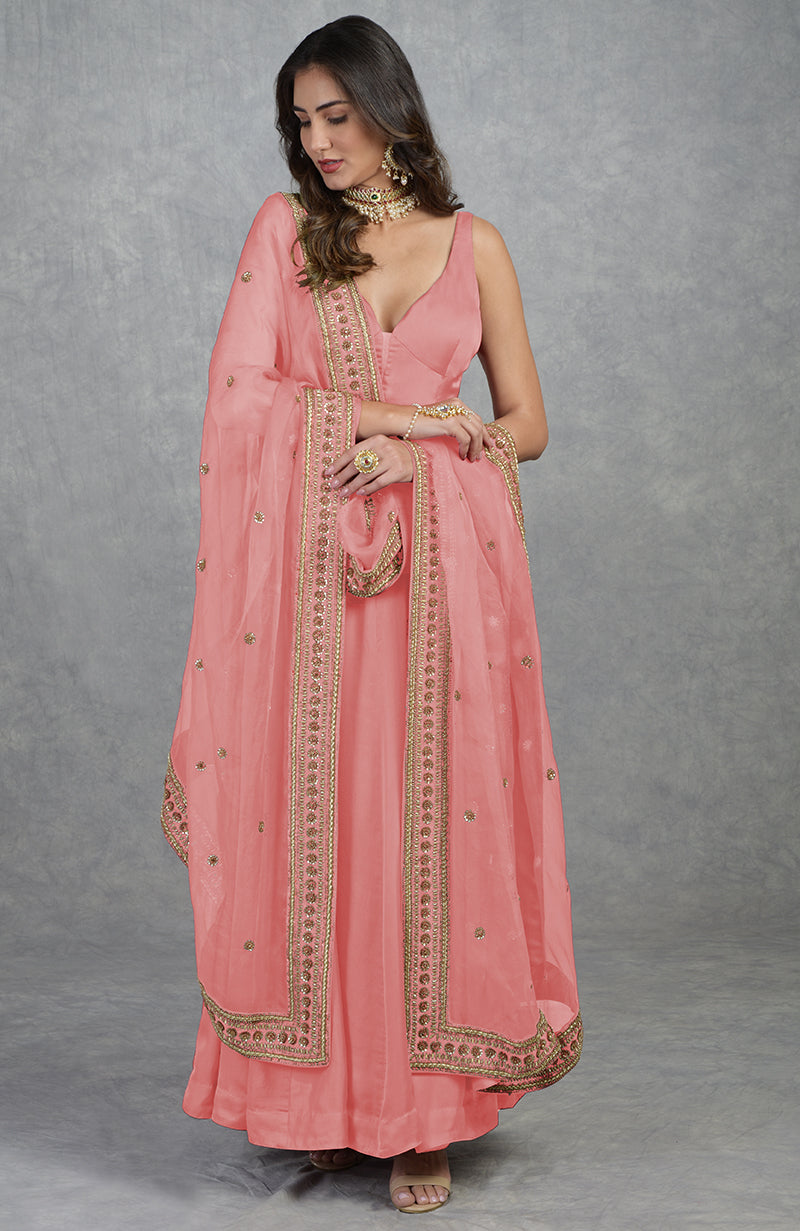 Garnet red Anarkali set with hand-embroidered zardozi floral motifs and organza dupatta.