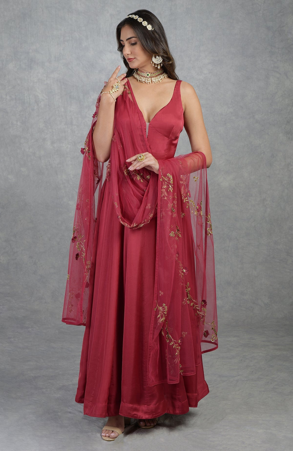 Garnet red Anarkali set with 3D floral suede petals and hand-embroidered crystal beads on tulle.