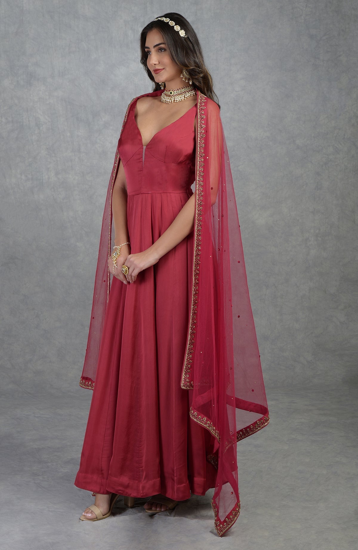 Garnet red Anarkali set with hand-embroidered zardozi floral patterns and matching churidar.