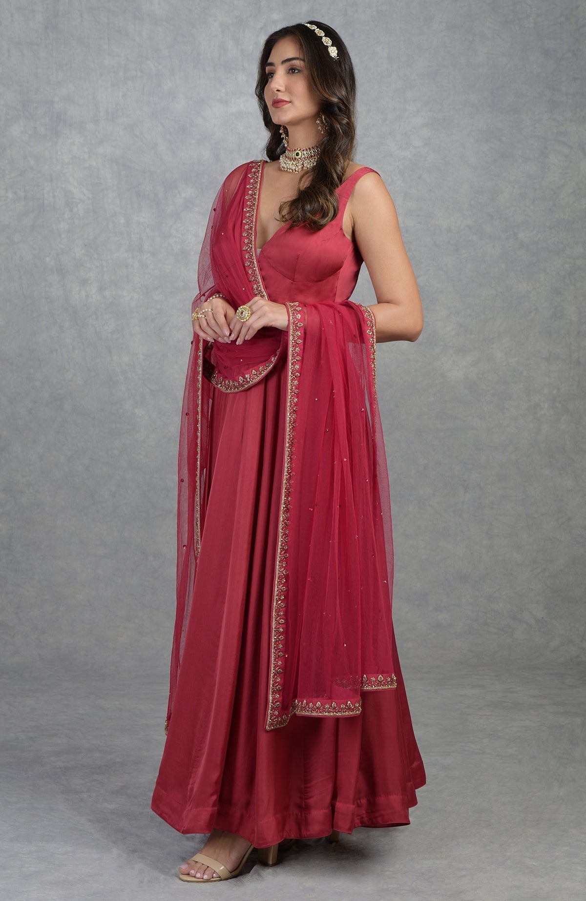 Garnet red Anarkali set with hand-embroidered zardozi floral patterns and matching churidar.