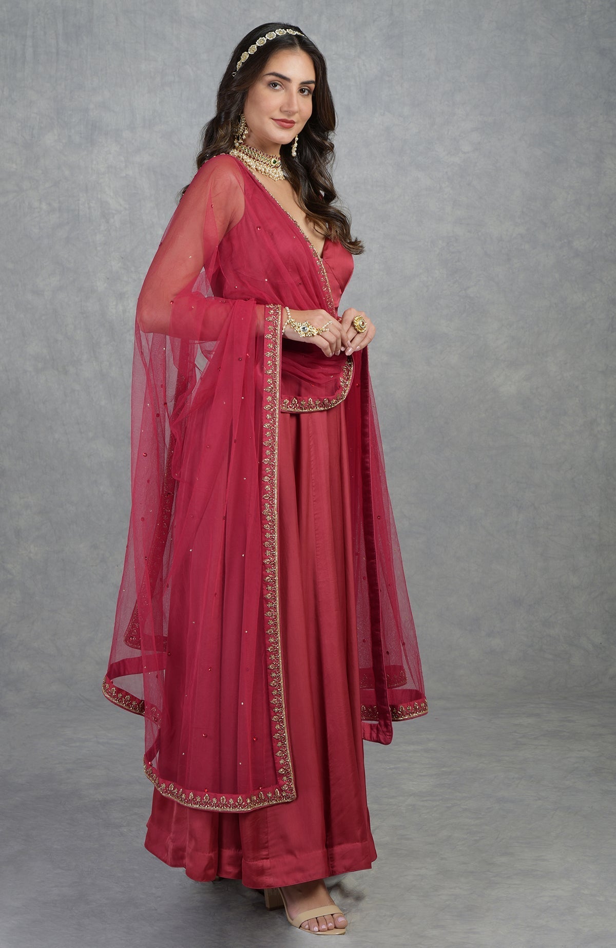 Garnet Anarkali set with hand-embroidered zardozi floral design and matching tulle dupatta.