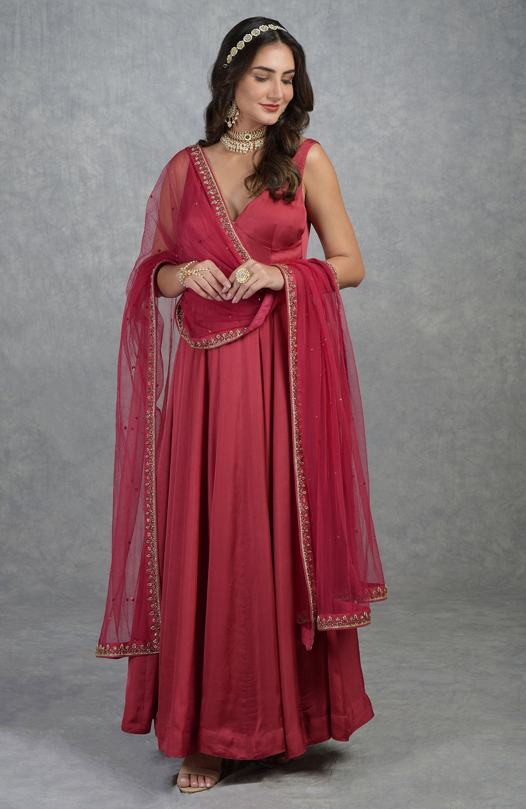 Garnet Anarkali set with hand-embroidered zardozi, cut beads, crystals, and tulle dupatta.