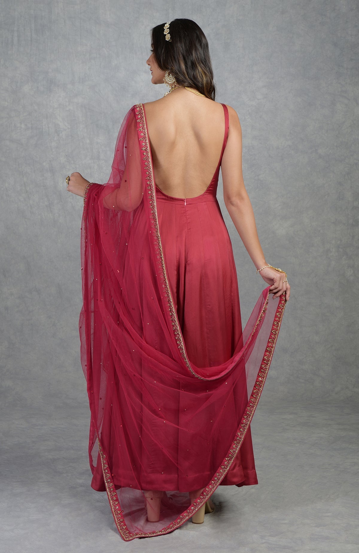 Garnet red Anarkali set with hand-embroidered zardozi floral patterns and matching churidar.