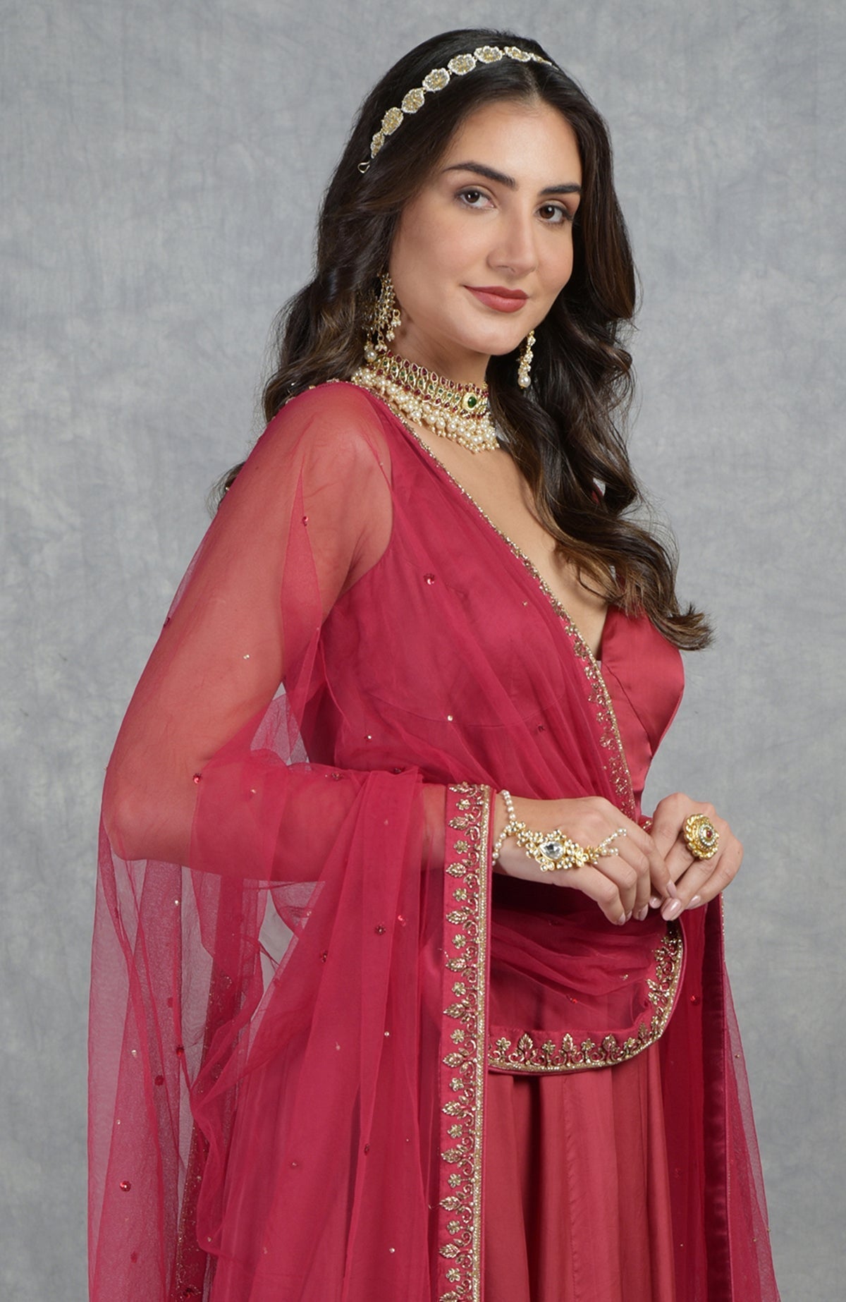 Garnet red Anarkali set with hand-embroidered zardozi, cut beads, and floral motifs on organza.