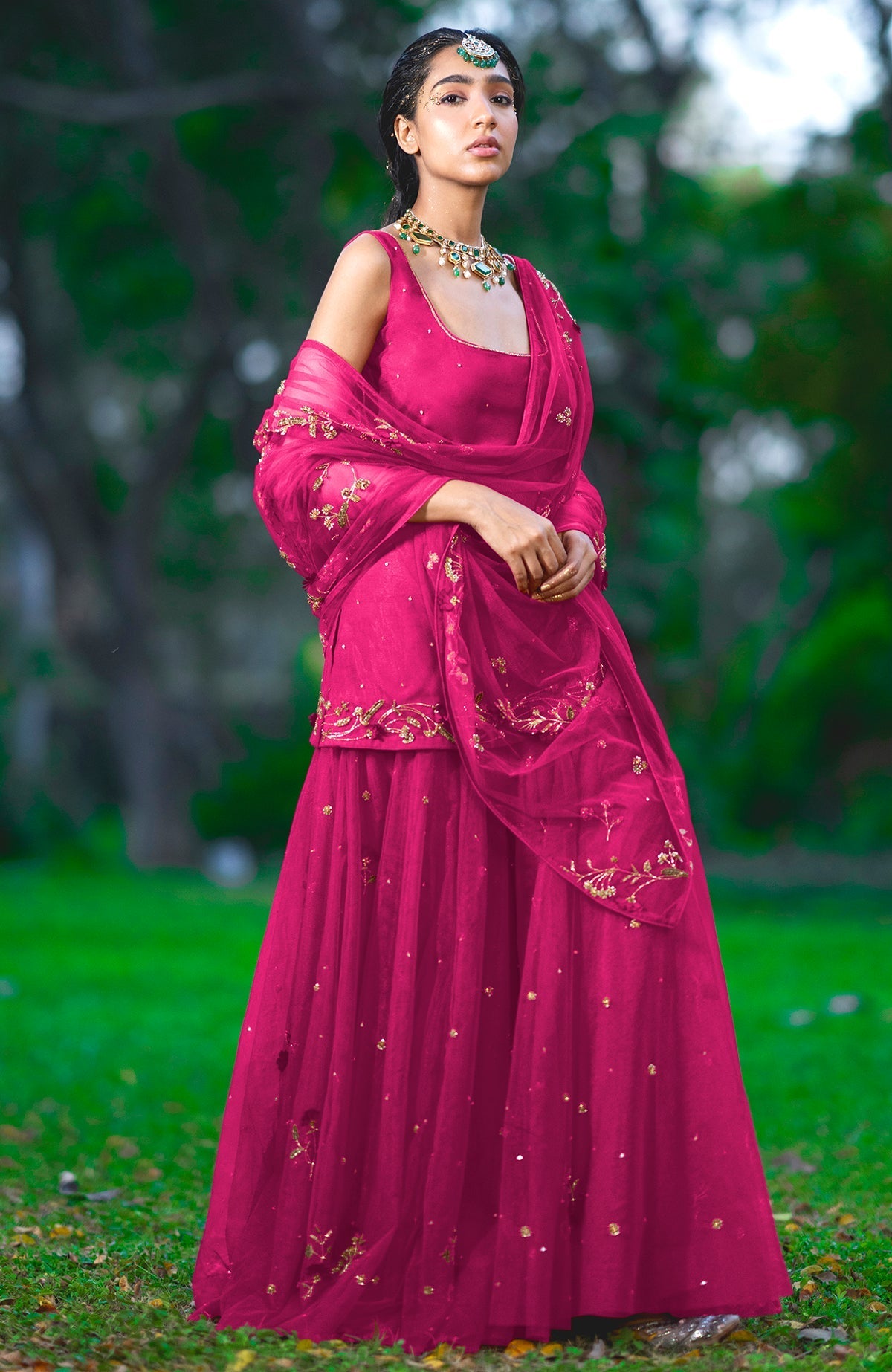 Red sharara set with 3D floral and zardozi hand embroidery on tulle fabric.