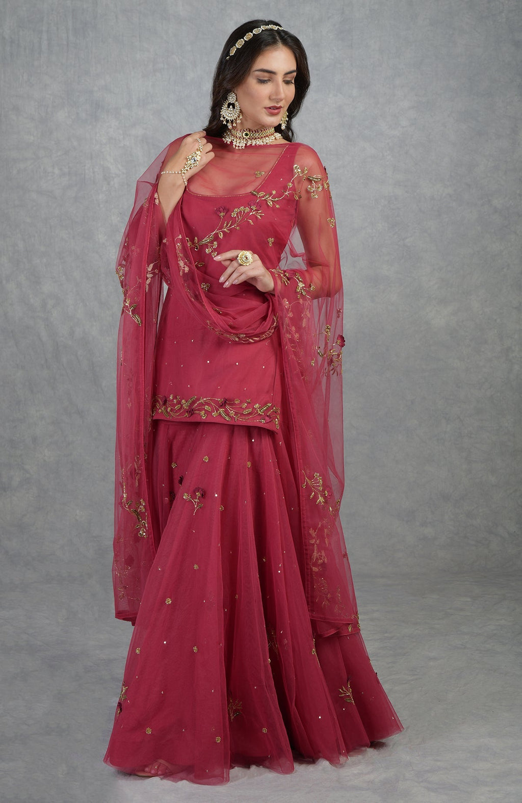 Red sharara set with 3D floral and gold zardozi hand embroidery on tulle fabric.