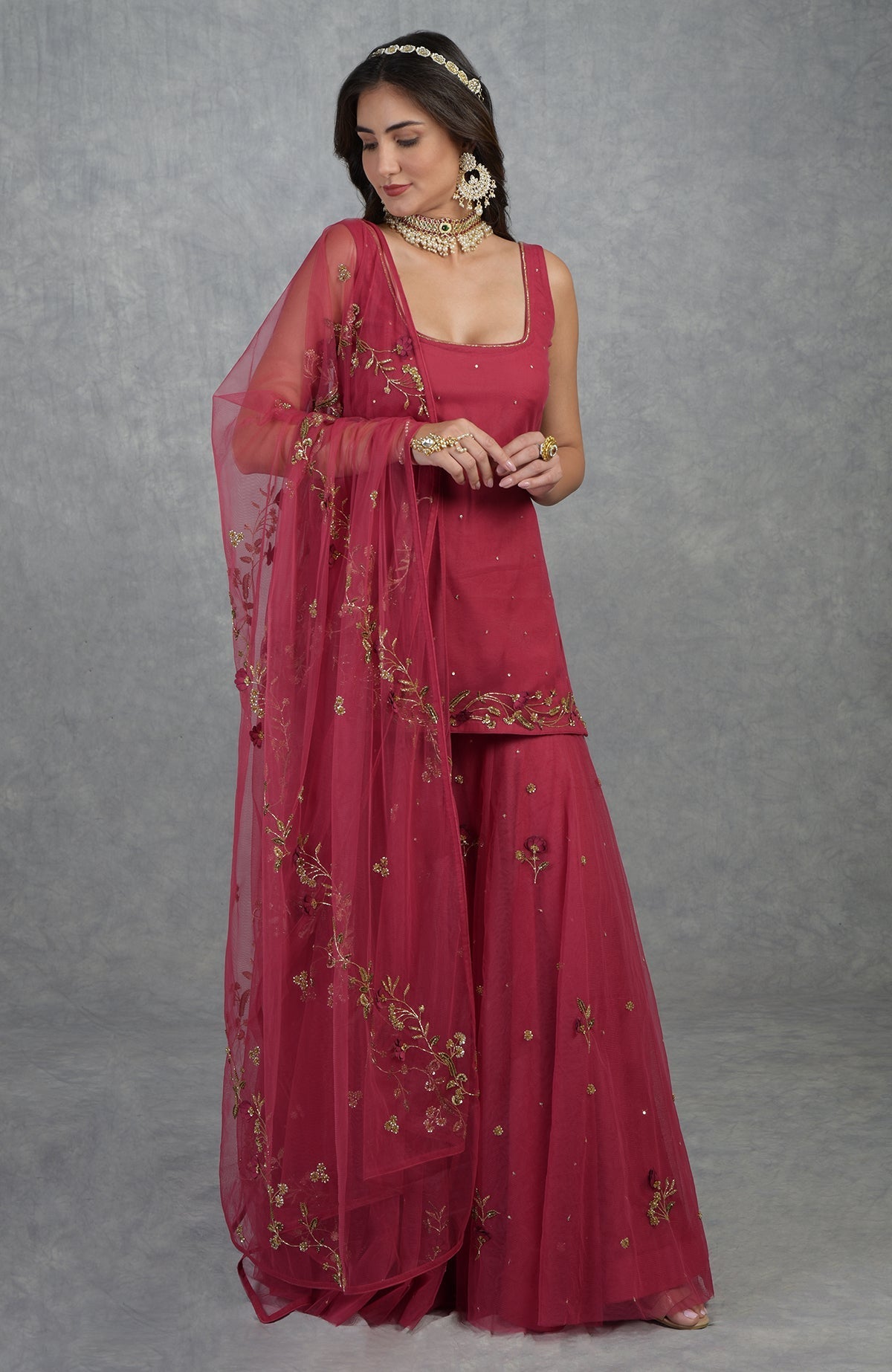 Red sharara set with 3D floral and gold zardozi hand embroidery on soft tulle fabric.