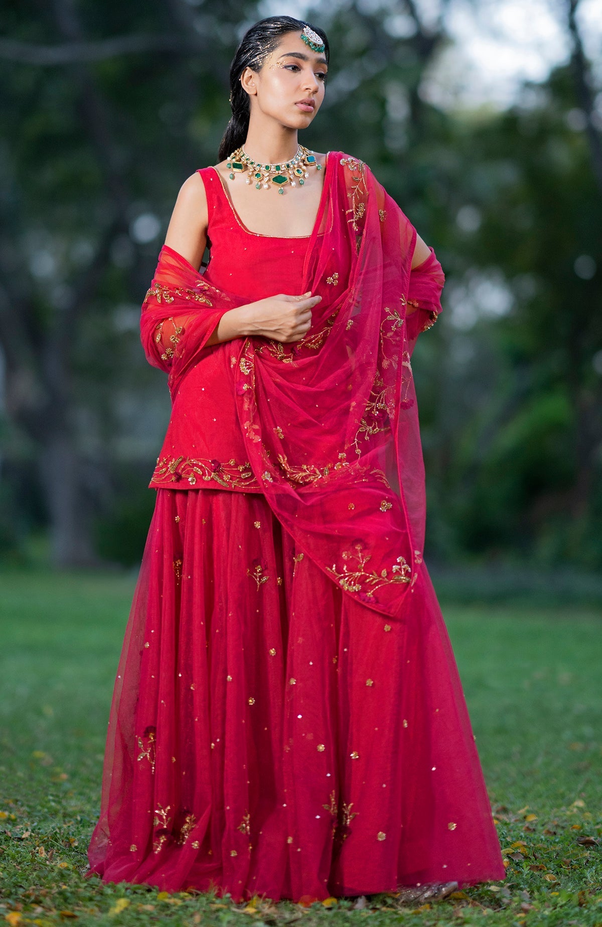 Mehandi green sharara set with 3D floral and zardozi hand embroidery on tulle fabric.