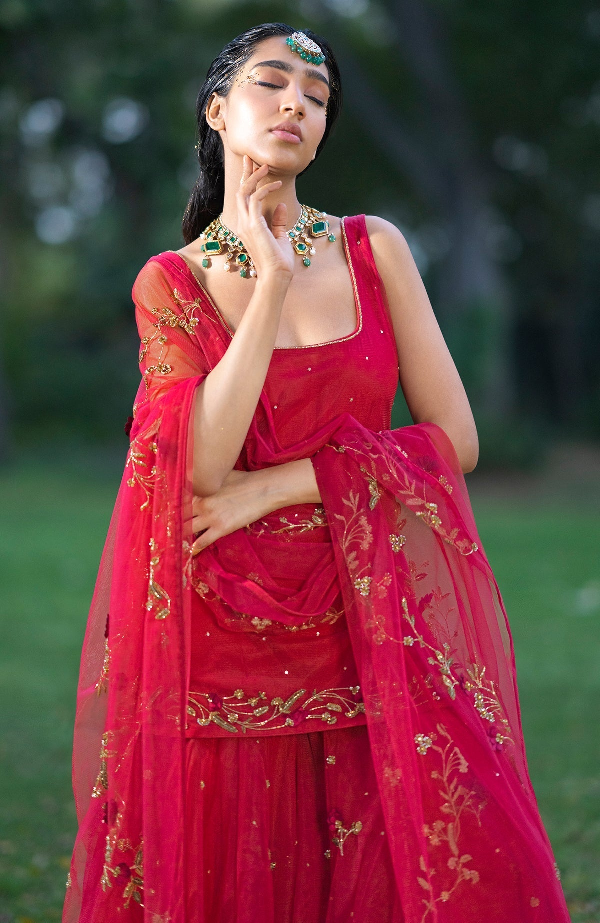 Red sharara set with 3D floral and zardozi hand embroidery on tulle fabric.