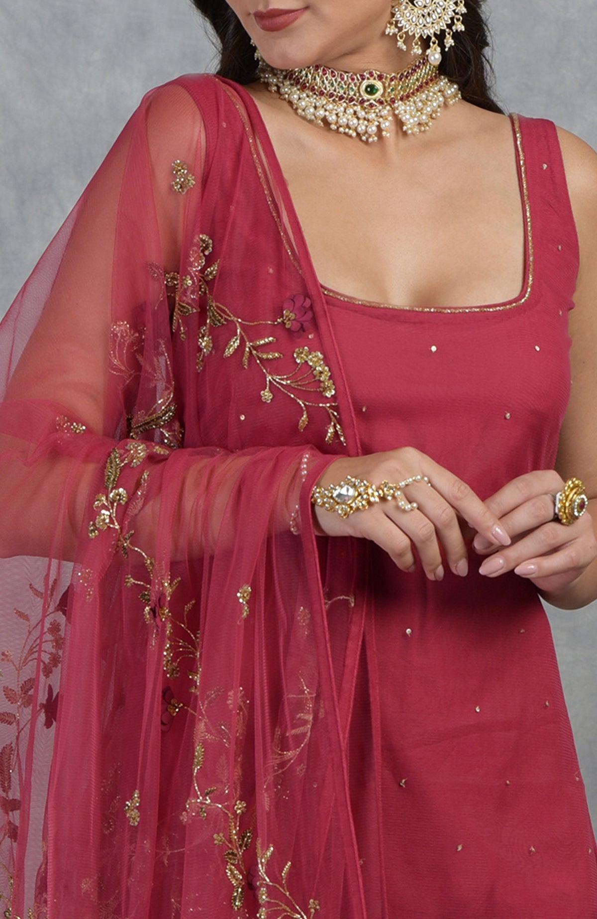 Red sharara set with 3D floral and zardozi hand embroidery on tulle fabric.