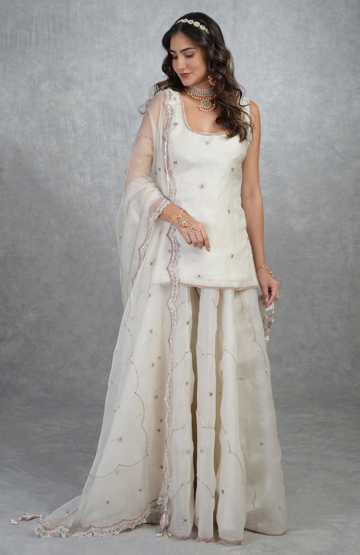 Off white silk organza sharara set with hand-embroidered floral beads, sequins, and crystal details