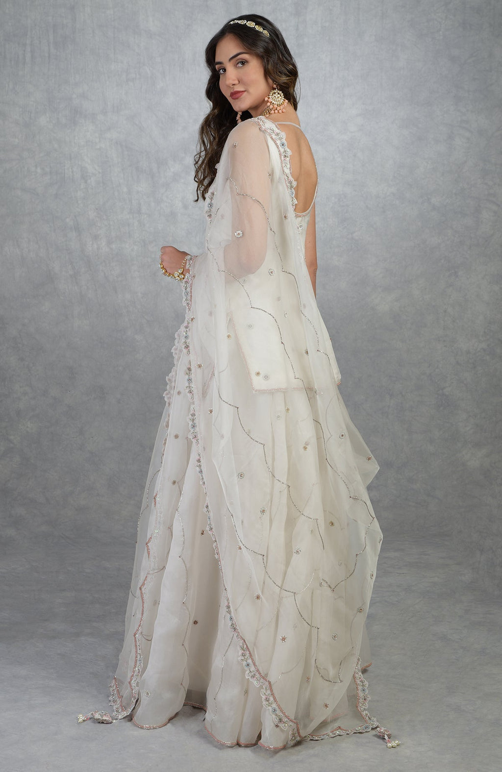 Off white floral hand-embroidered sharara set with silk organza kurta and dupatta details