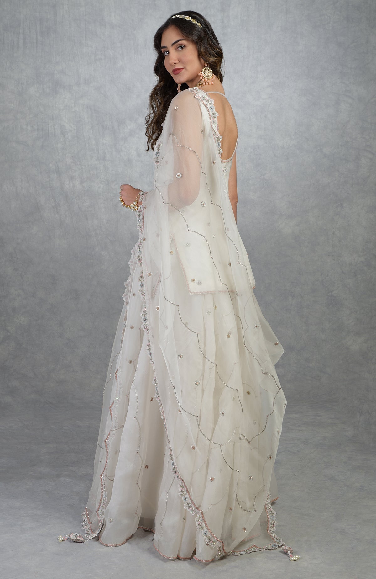 Off white floral hand-embroidered sharara set with silk organza kurta and dupatta details