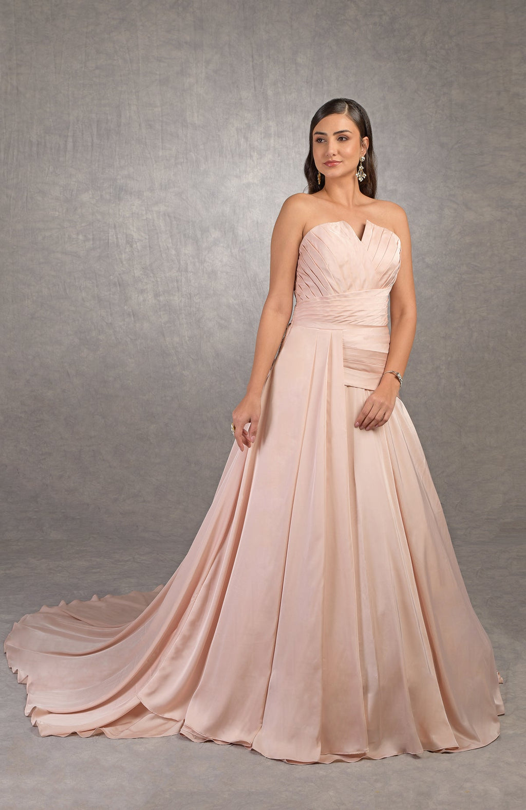 Strapless satin Athena gown with pleated draped bodice and circular train.