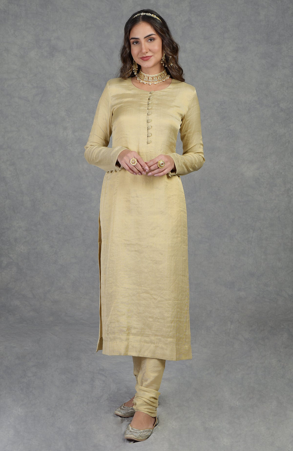 Gold tissue handwoven Banarasi kurta suit with round neck and long sleeves.