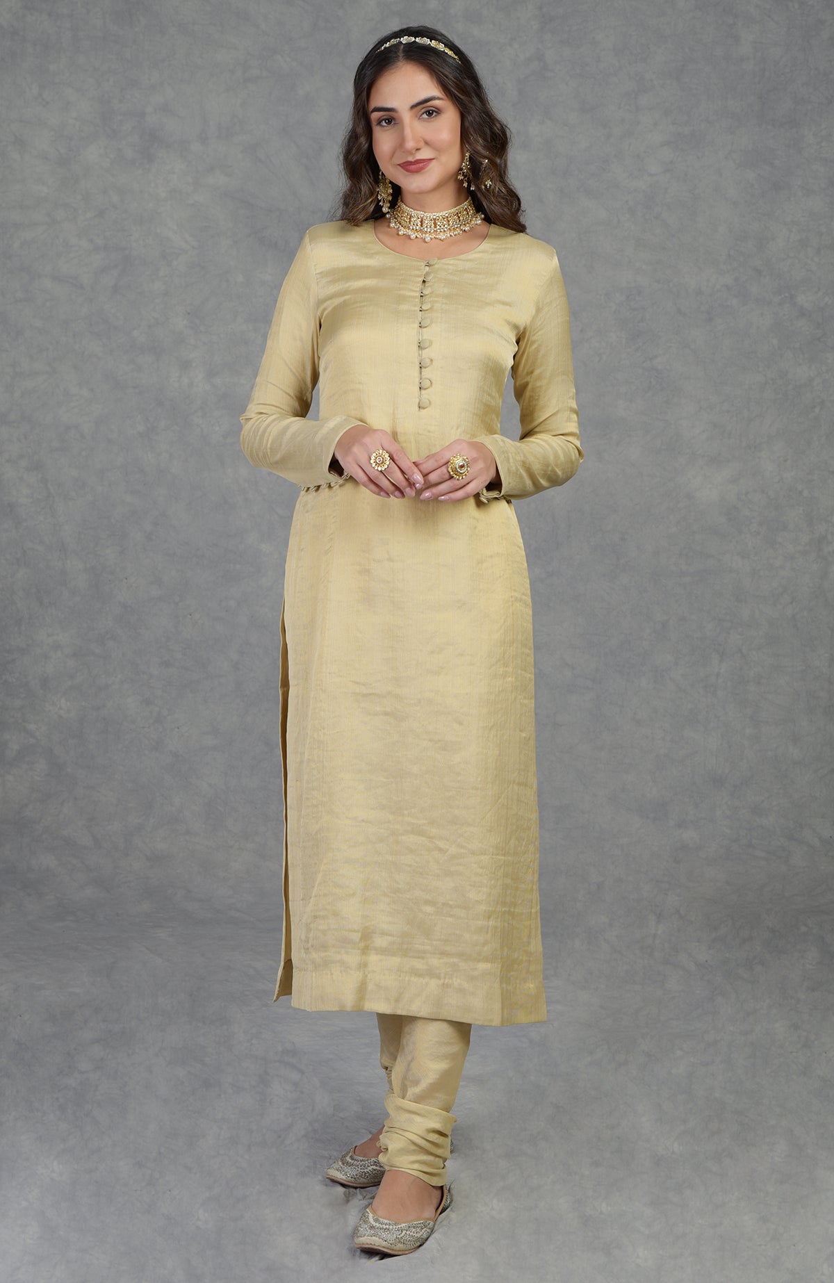 Gold tissue handwoven Banarasi kurta suit with round neck and long sleeves.