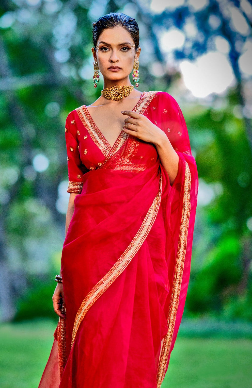 Red organza silk saree with gold and red crystal bead and zari hand embroidery