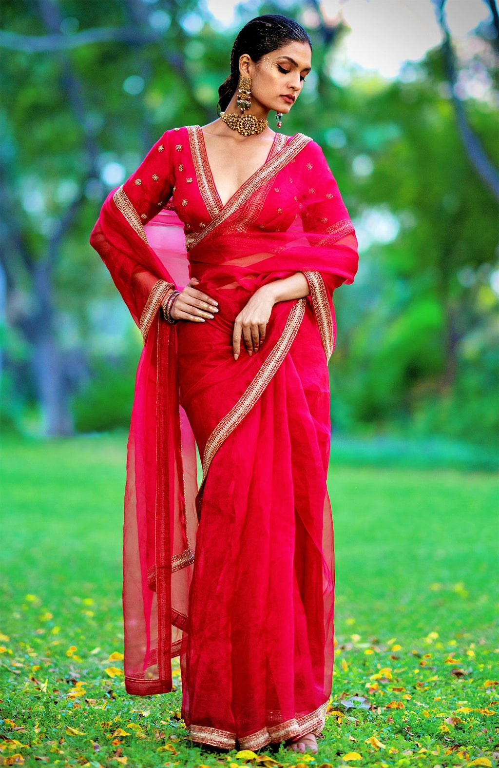 Red organza silk saree with gold and red crystal bead and zari hand embroidery