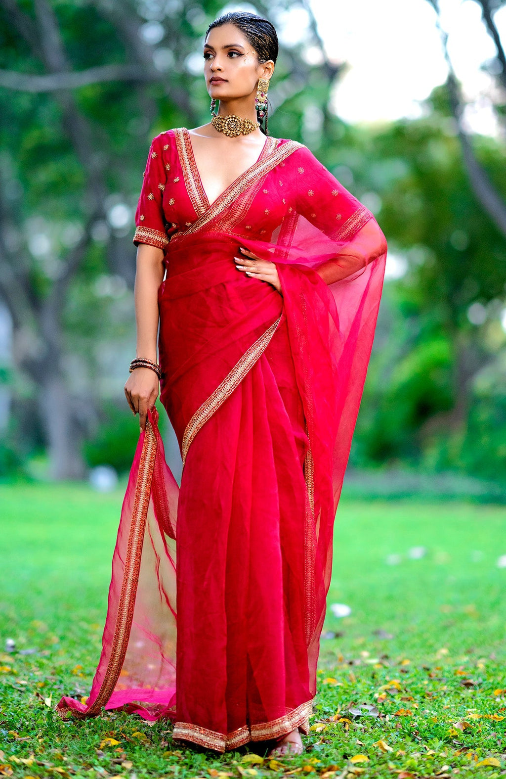 Red organza silk saree with gold and red crystal bead and zari hand embroidery