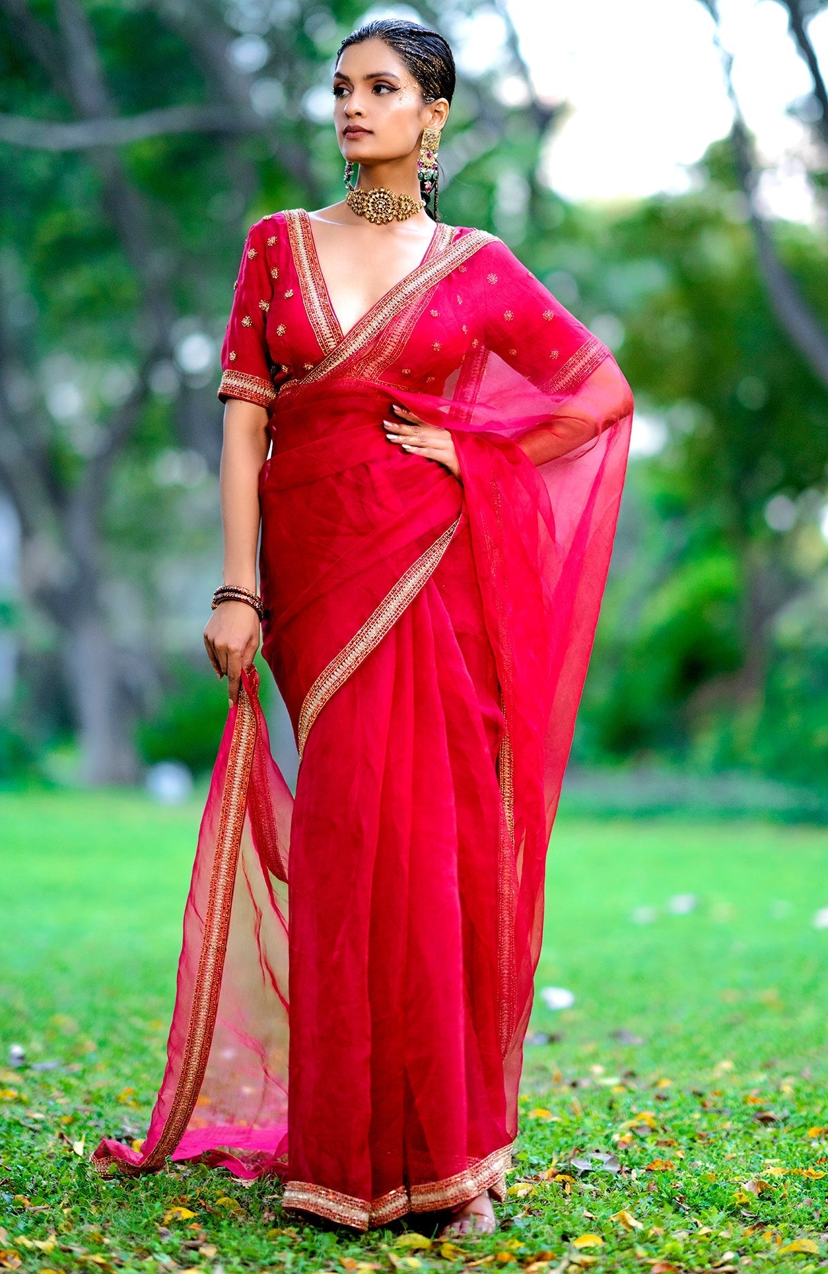 Red organza silk saree with gold and red crystal bead and zari hand embroidery