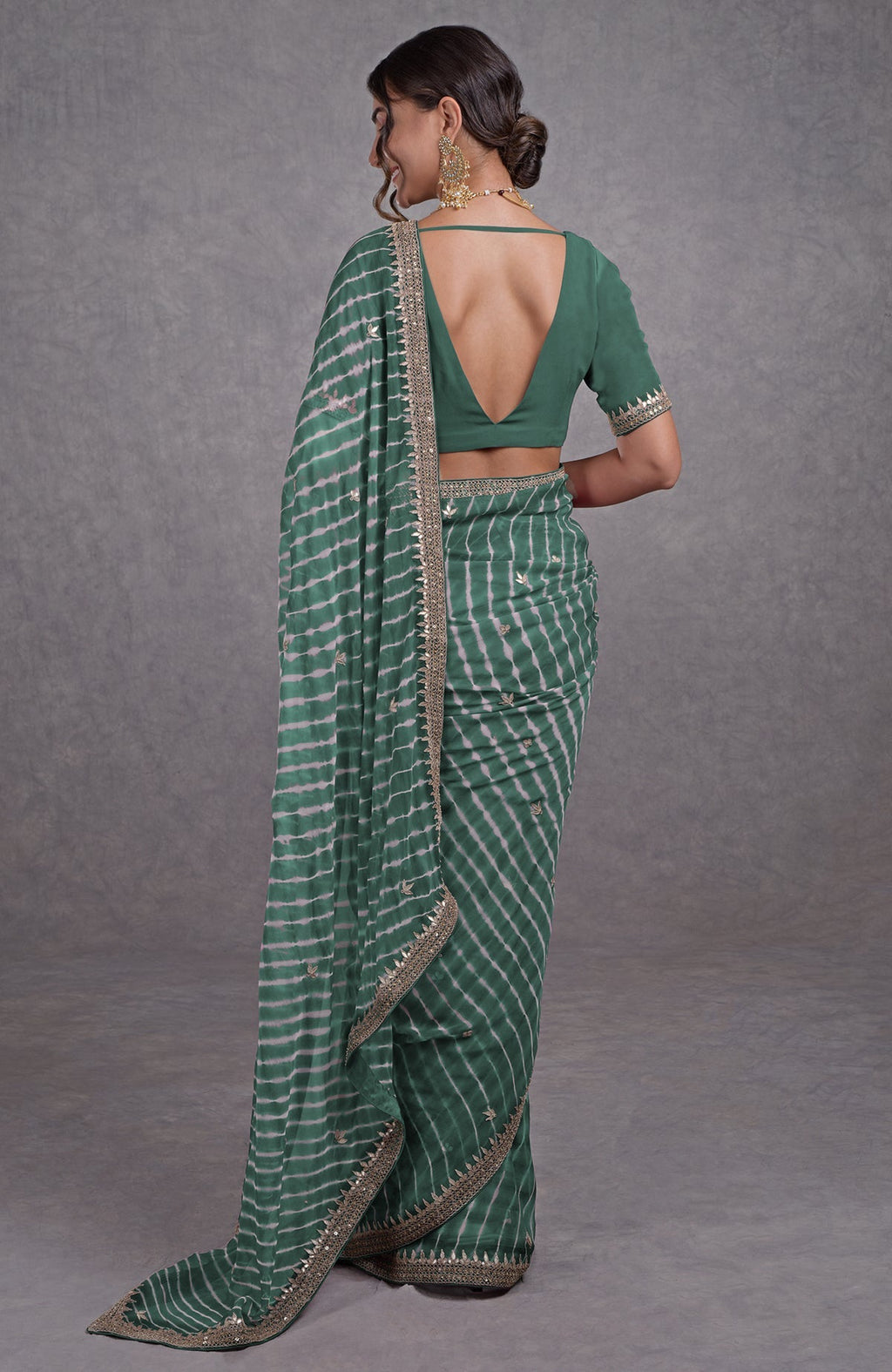 Jade leheriya saree with rose gold marori-gota patti embroidery and a deep V-back blouse.