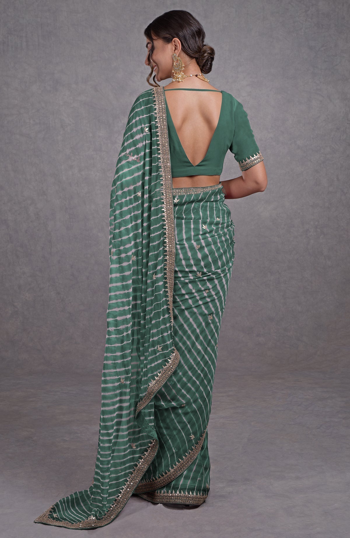 Jade leheriya saree with rose gold marori-gota patti embroidery and a deep V-back blouse.