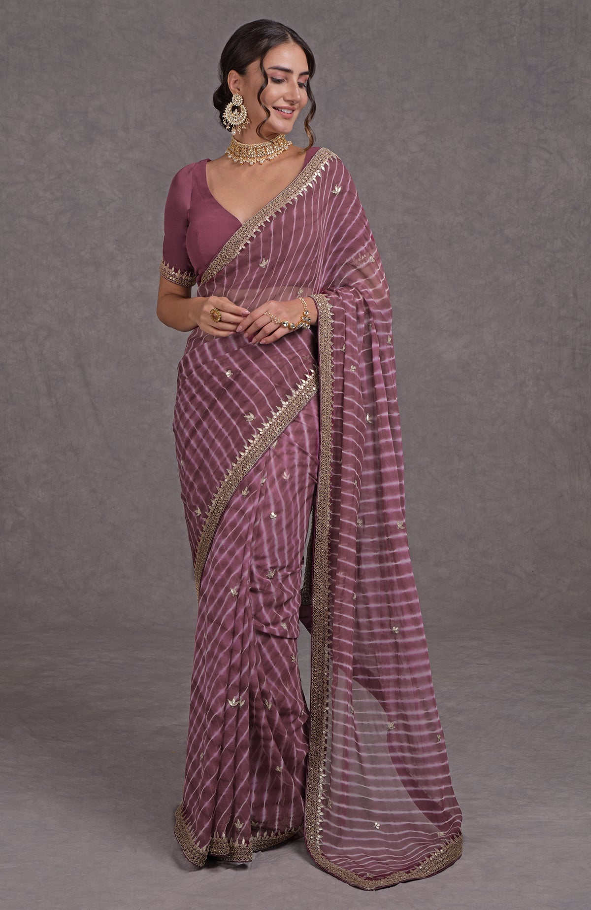 Burgundy chiffon saree with purple leheriya and rose gold marori-gota patti hand embroidery.